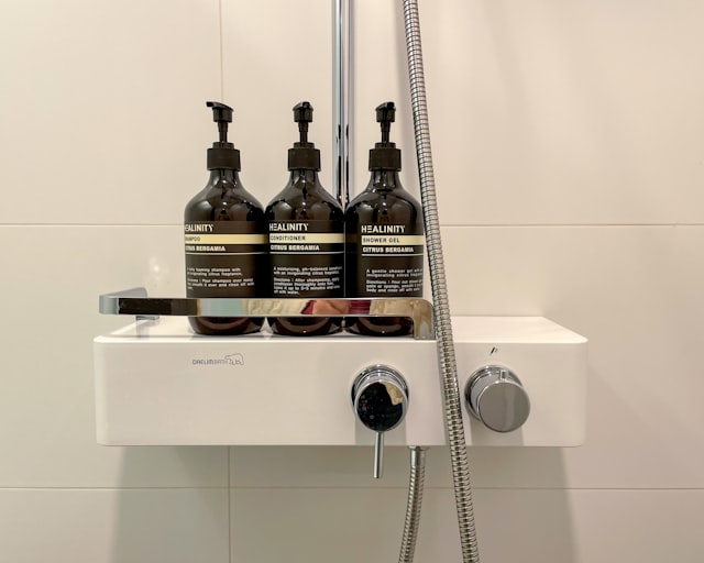 Mini shampoo and conditioner bottles for guest turnover